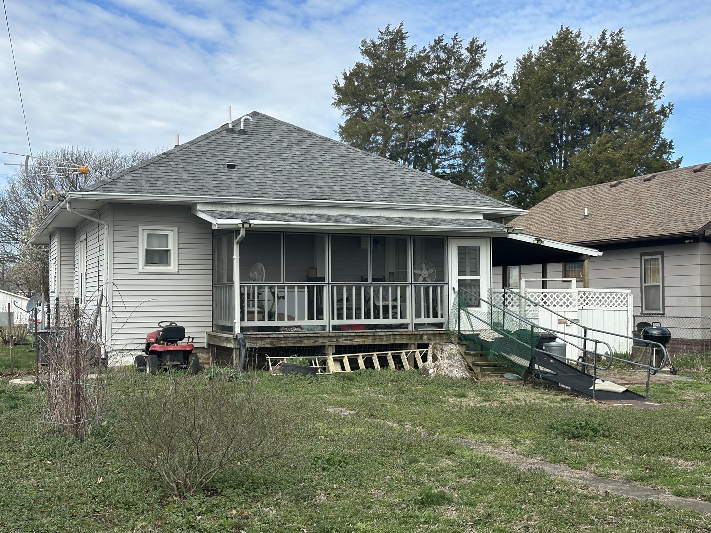 410 South Walnut Street Sesser, IL 62884 - Photo 8 of 22 a backyard of a house with wooden deck table and chairs