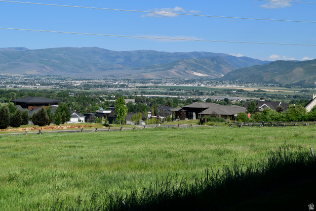 514 North Olympic Way Midway, UT 84049 - Photo 8 of 30 Expansive green field with distant mountain ranges and a valley landscape