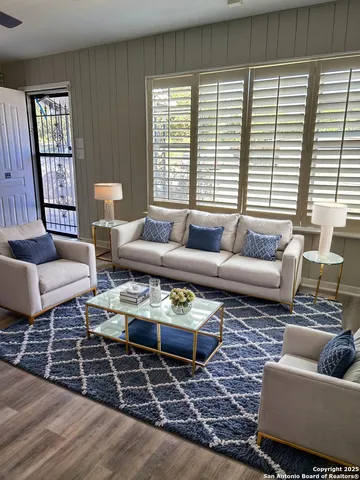 a living room with furniture and a rug