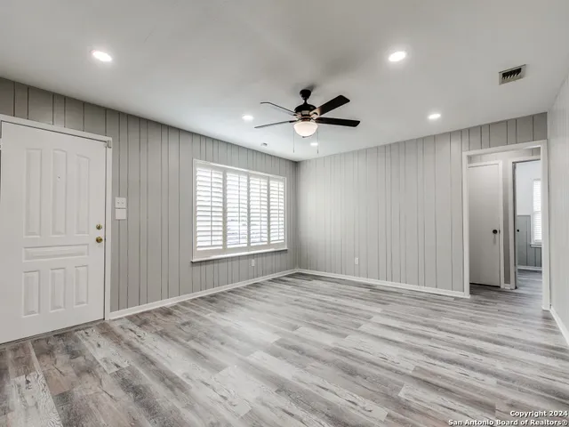 a view of an empty room with a window