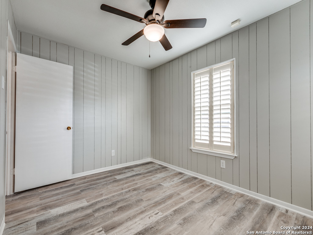 215 Midland Drive San Antonio, TX 78219 - Photo 23 of 35 a view of empty room with wooden floor and fan