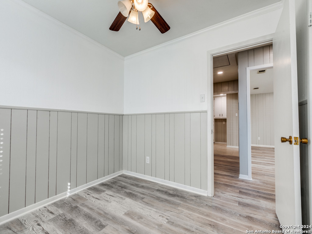 215 Midland Drive San Antonio, TX 78219 - Photo 24 of 35 a view of an empty room and wooden floor