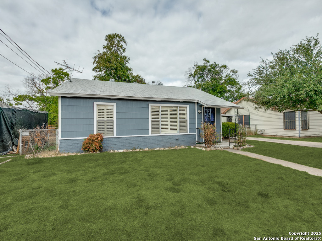 215 Midland Drive San Antonio, TX 78219 - Photo 29 of 35 front view of a house with a yard