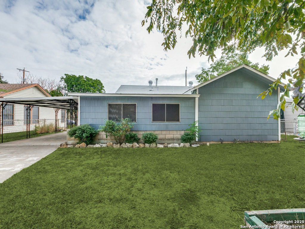 215 Midland Drive San Antonio, TX 78219 - Photo 34 of 35 a front view of a house with a yard