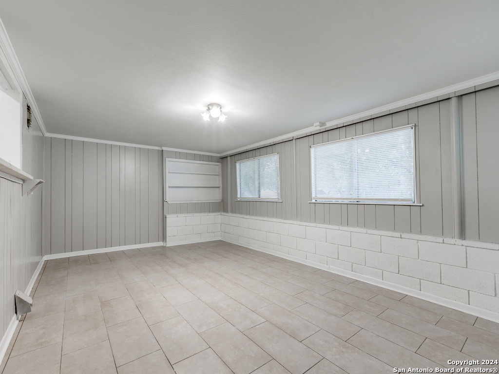 215 Midland Drive San Antonio, TX 78219 - Photo 5 of 35 a view of an empty room with a window