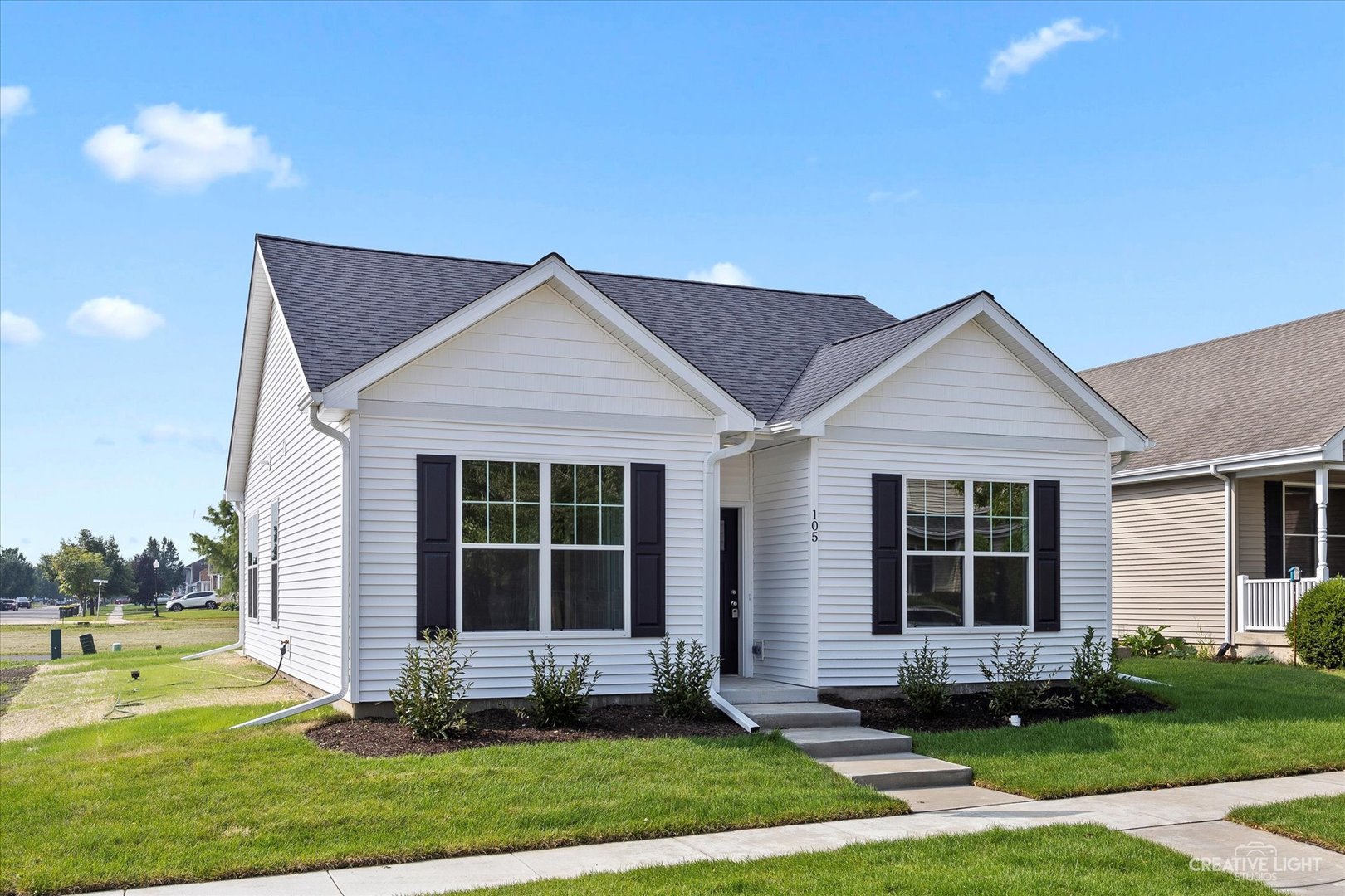 110 Riverbend Drive Genoa, IL 60135 - Photo 2 of 28 a front view of a house with a yard