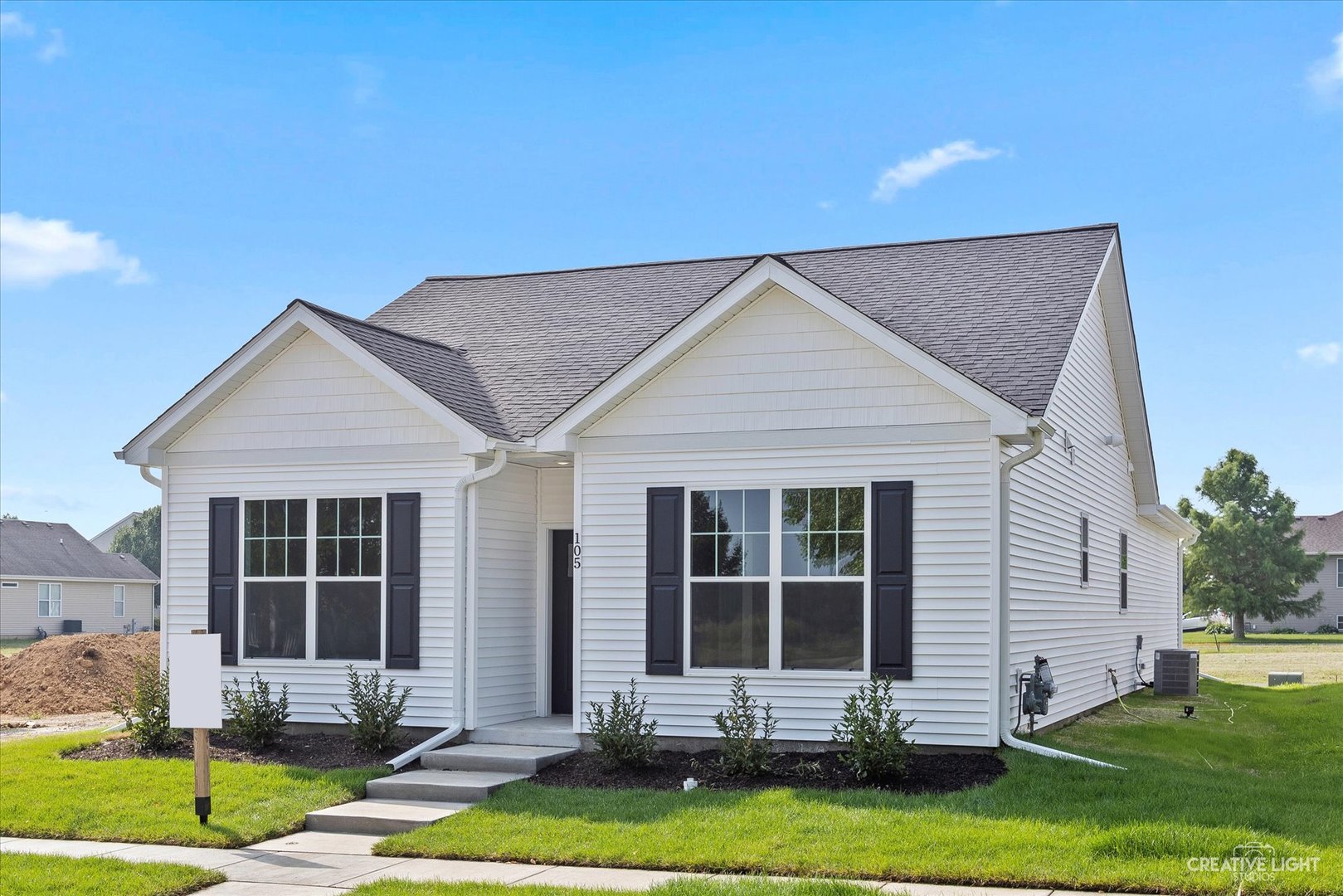 110 Riverbend Drive Genoa, IL 60135 - Photo 3 of 28 a front view of a house with yard and glass windows