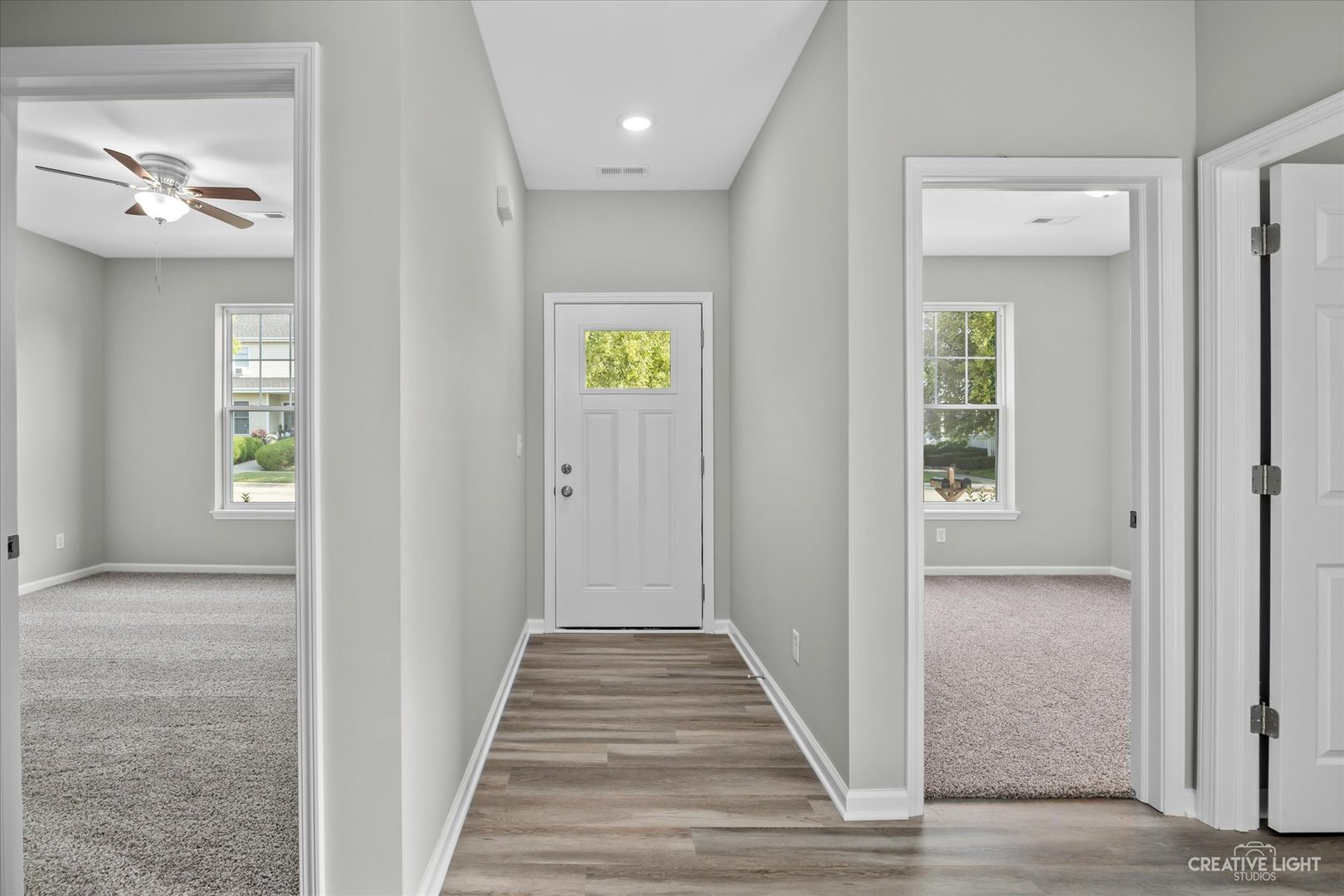 110 Riverbend Drive Genoa, IL 60135 - Photo 4 of 28 a view of a hallway with wooden floor and staircase