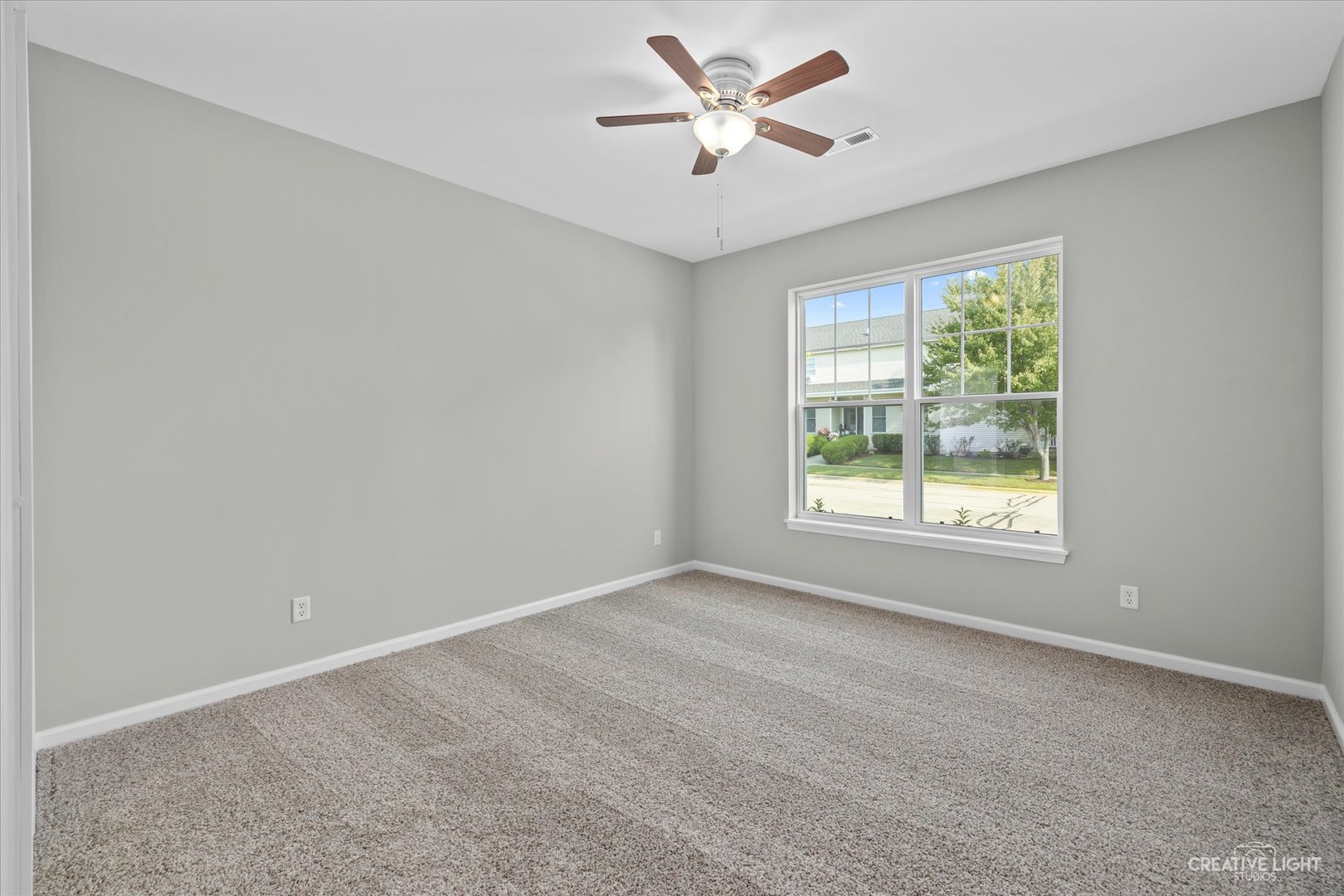 110 Riverbend Drive Genoa, IL 60135 - Photo 6 of 28 a view of an empty room with a window
