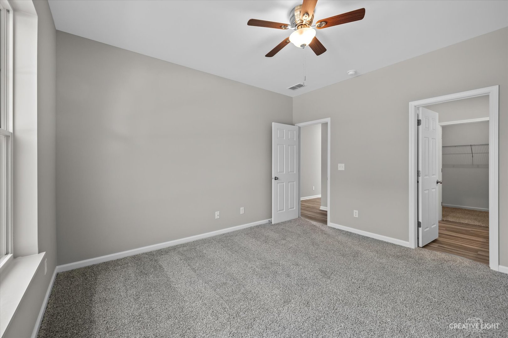110 Riverbend Drive Genoa, IL 60135 - Photo 7 of 28 a view of an empty room and chandelier fan