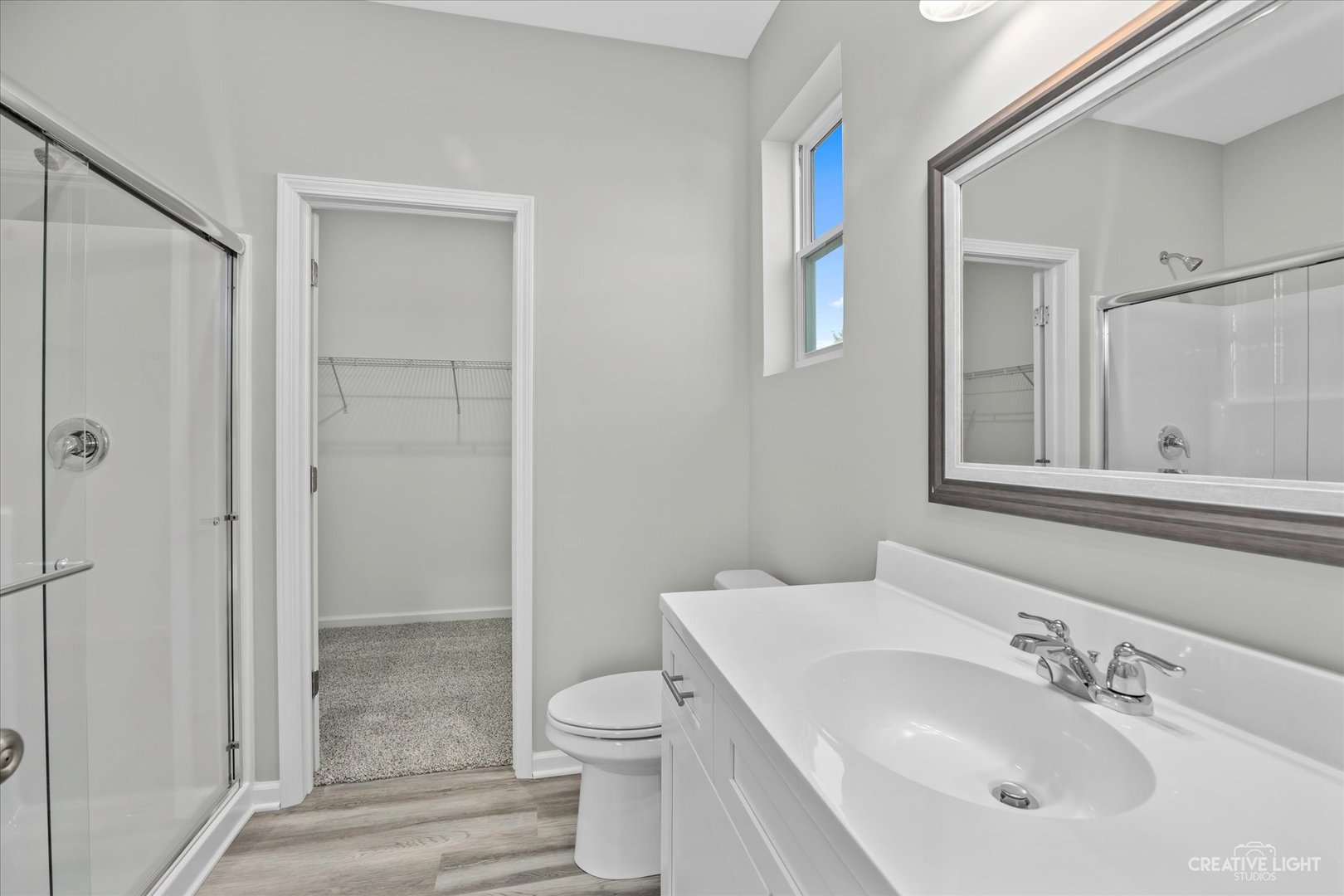 110 Riverbend Drive Genoa, IL 60135 - Photo 8 of 28 a bathroom with a sink toilet and shower