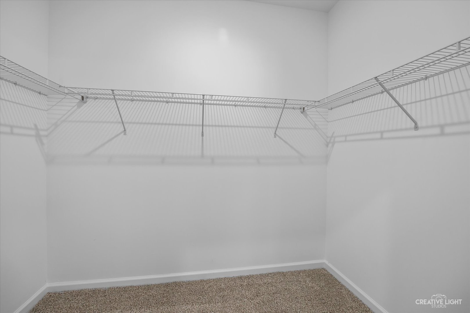 110 Riverbend Drive Genoa, IL 60135 - Photo 10 of 28 a view of a room with racks on the wall