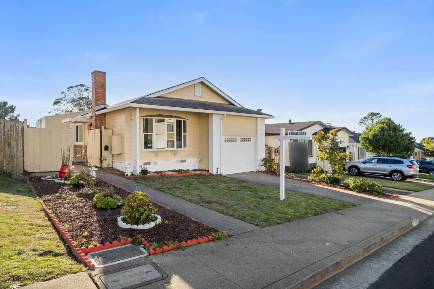 a front view of a house with garden