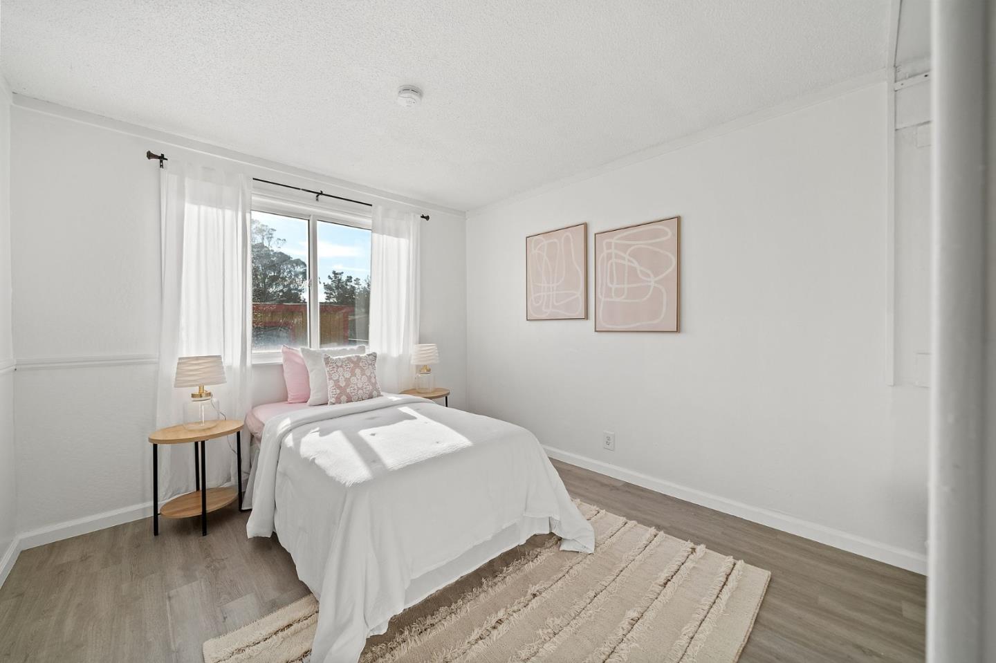 654 Foothill Drive Pacifica, CA 94044 - Photo 13 of 24 a bedroom with a bed and a window