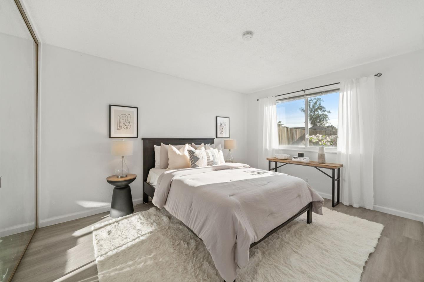 654 Foothill Drive Pacifica, CA 94044 - Photo 15 of 24 a bedroom with a bed and window