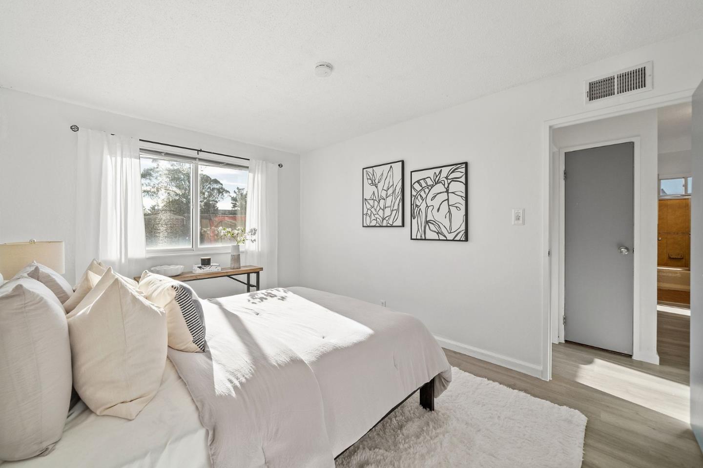 654 Foothill Drive Pacifica, CA 94044 - Photo 16 of 24 a bed sitting in a bedroom next to a window