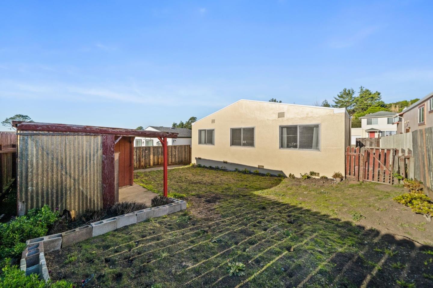654 Foothill Drive Pacifica, CA 94044 - Photo 24 of 24 a view of a house with backyard and trees