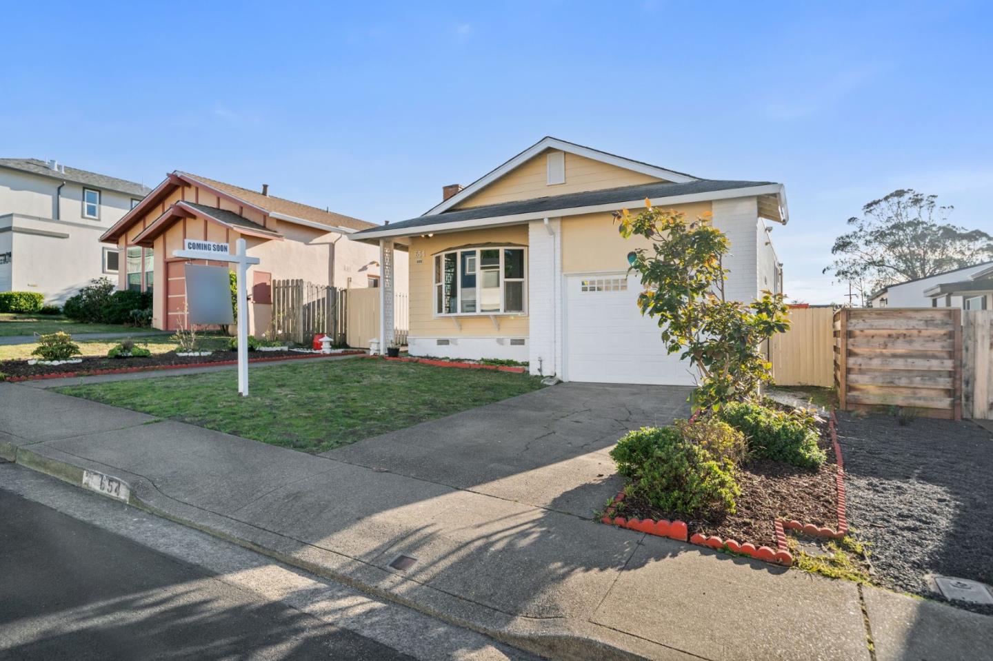 654 Foothill Drive Pacifica, CA 94044 - Photo 3 of 24 a front view of a house with a yard