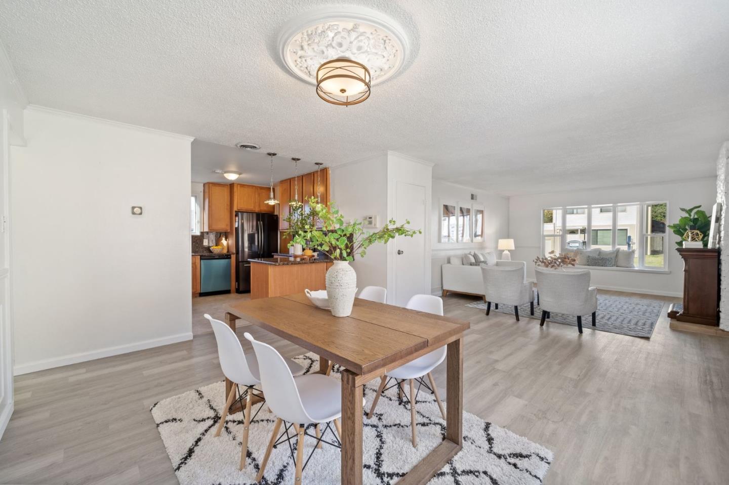 654 Foothill Drive Pacifica, CA 94044 - Photo 7 of 24 a view of a dining room with furniture and wooden floor