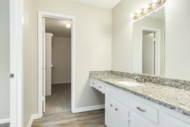 a view of vanity and mirror