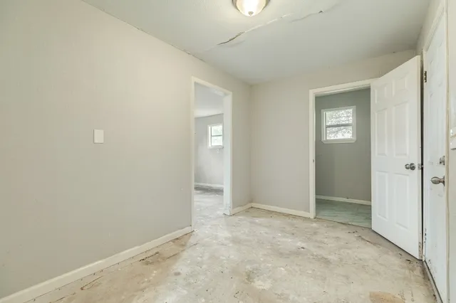 an empty room with closet area