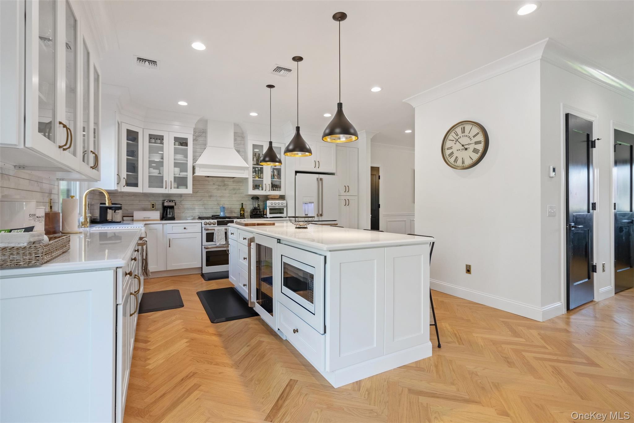 580 Stars Road East Marion, NY 11939 - Photo 4 of 18 a kitchen with stainless steel appliances granite countertop a stove a sink a oven and a refrigerator
