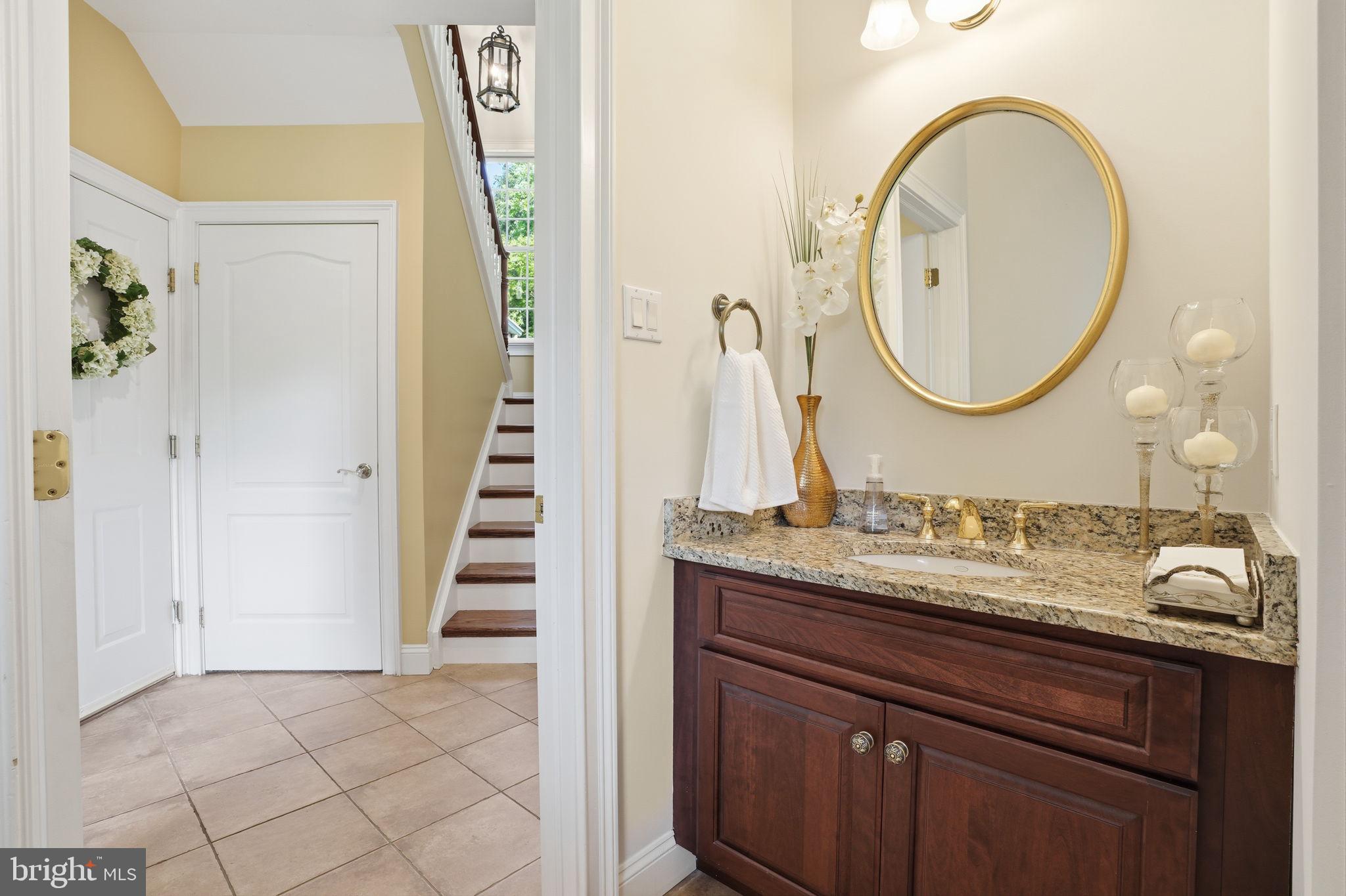 1588 Wrightstown Road Newtown, PA 18940 - Photo 45 of 81 a bathroom with a granite countertop sink and a mirror
