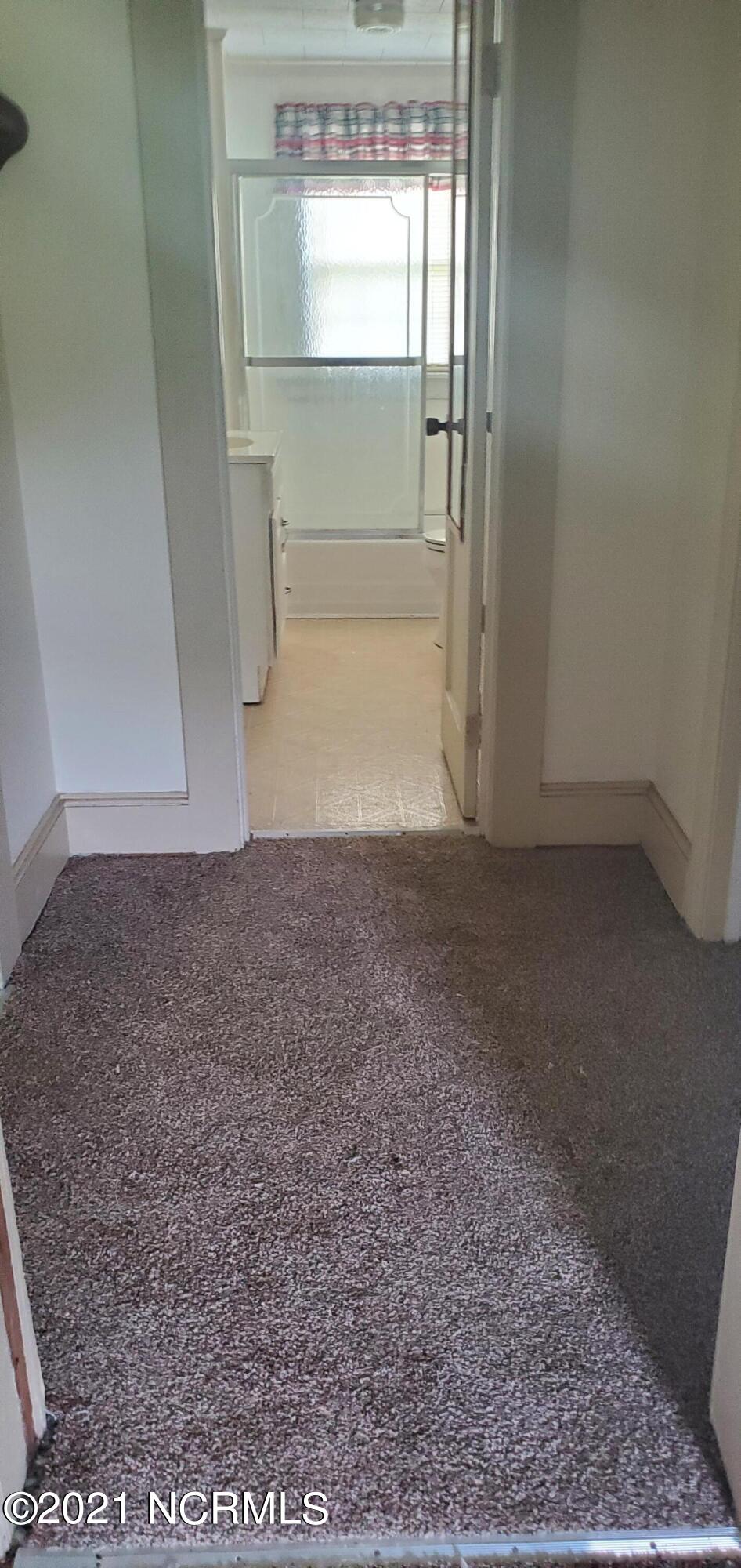3843 Wells Road Whitakers, NC 27891 - Photo 19 of 24 hall way to main bath