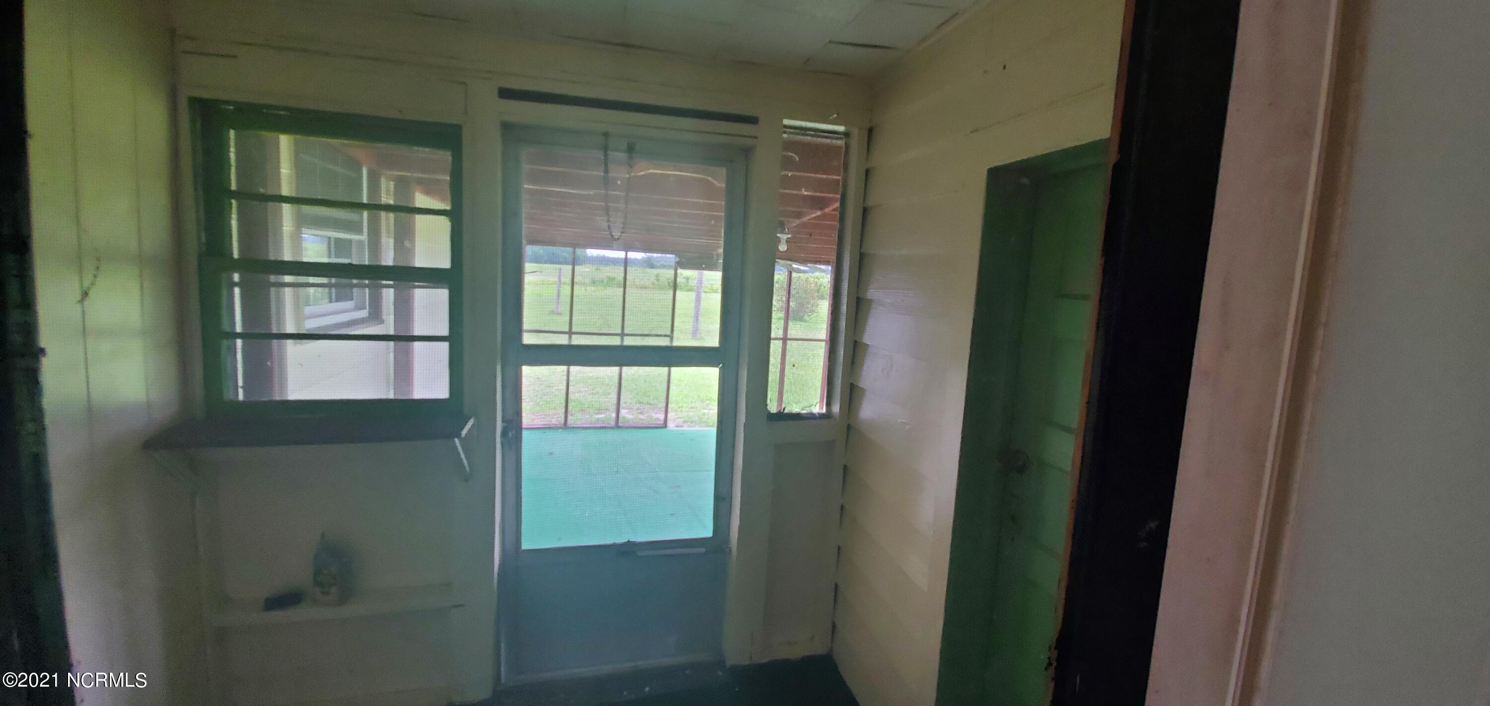 3843 Wells Road Whitakers, NC 27891 - Photo 23 of 24 Enclosed Porch-mudroom view 220210626_13