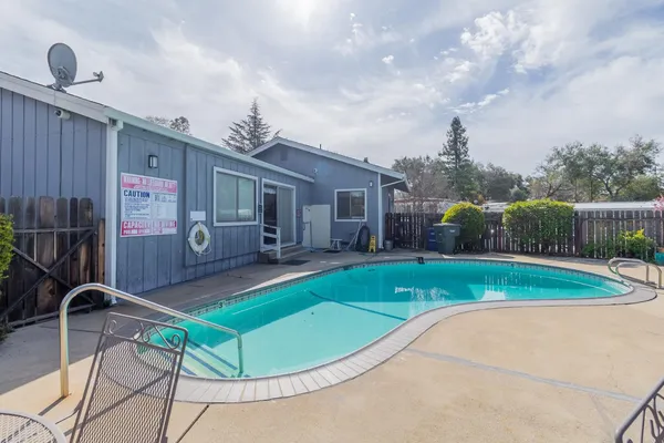 a view of a backyard with furniture