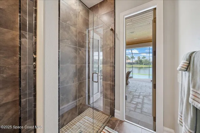 a view of walk in closet with clothes