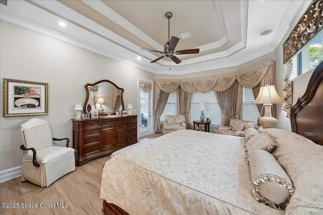 a spacious bathroom with a double vanity sink mirror and bathtub