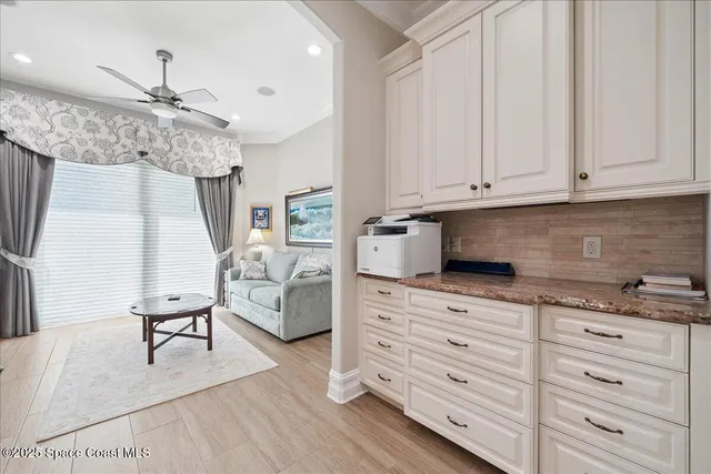 a bedroom with a bed and a flat tv screen