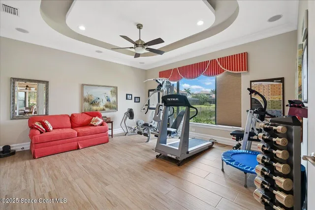 a kitchen with a refrigerator sink and cabinets