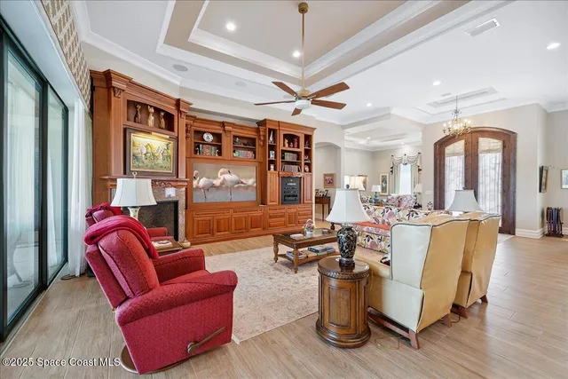 a living room with furniture or couch and a potted plant