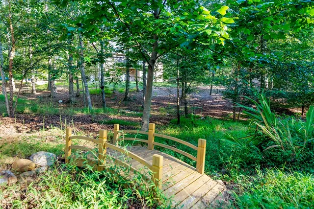 a view of kitchen with refrigerator dining table and chairs