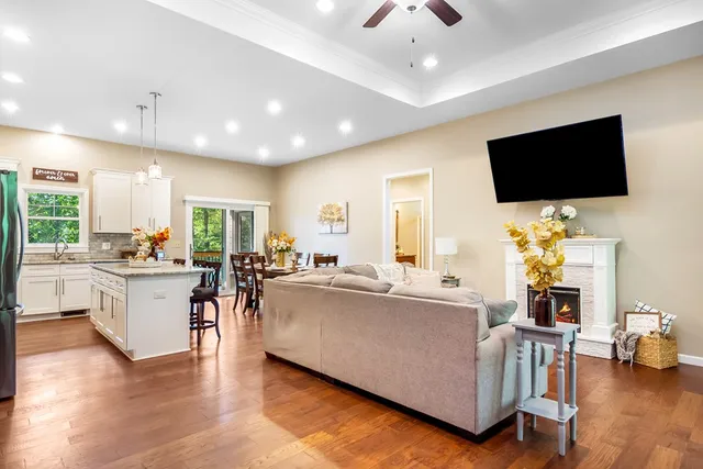 a kitchen with granite countertop living room and living room