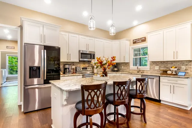 a utility room with sink dryer and washer