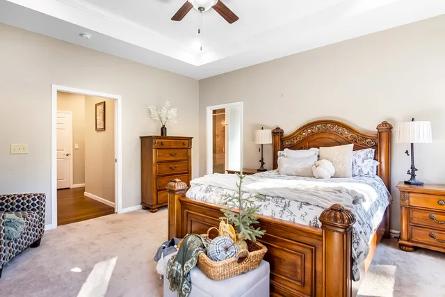 a bedroom with a bed and a couch