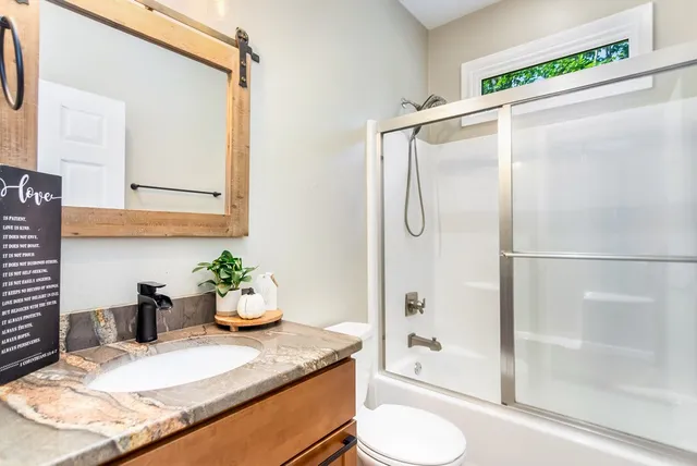 a kitchen with a table and chairs in it