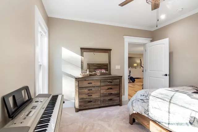 a view of a house with backyard and a tree