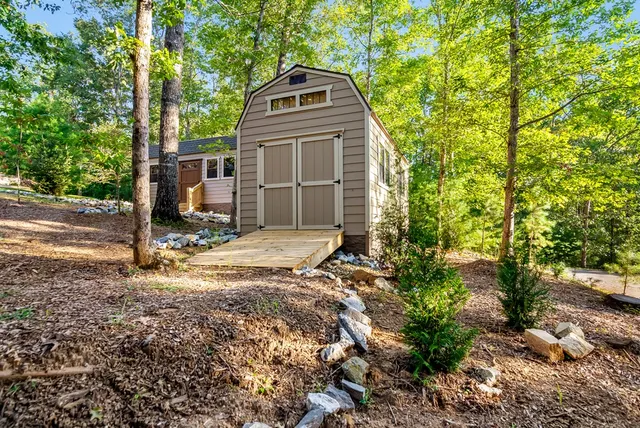 a garden with trees in the background