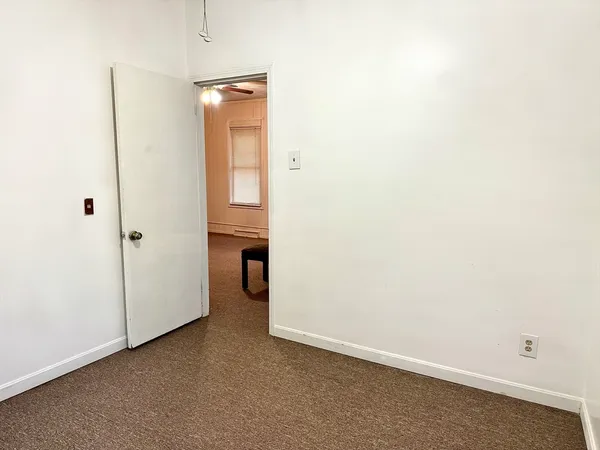 an empty room with a bathroom