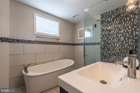 a bathroom with a sink and mirror