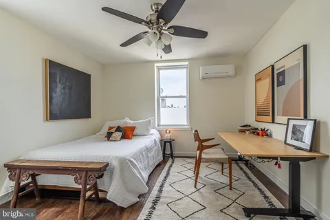 a bedroom with a bed and a table in it