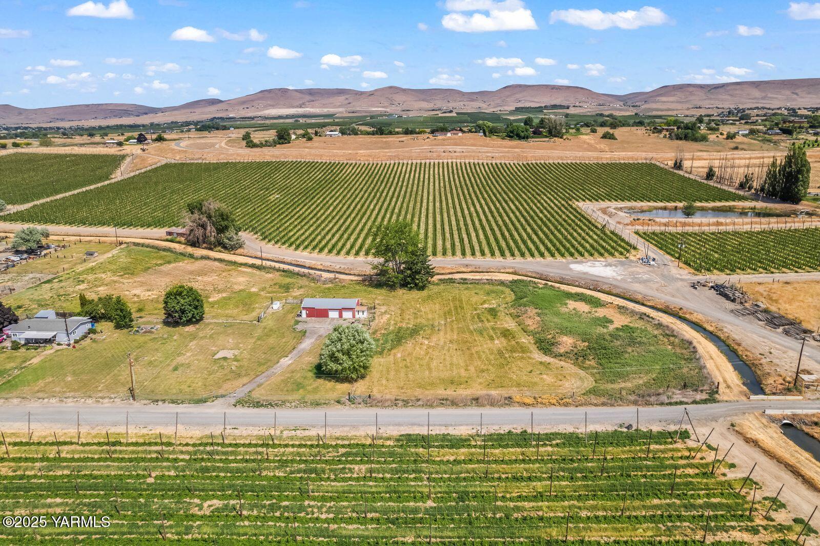 9031 Duffield Road Moxee, WA 98936 - Photo 7 of 19 a view of a lake with a mountain in the background