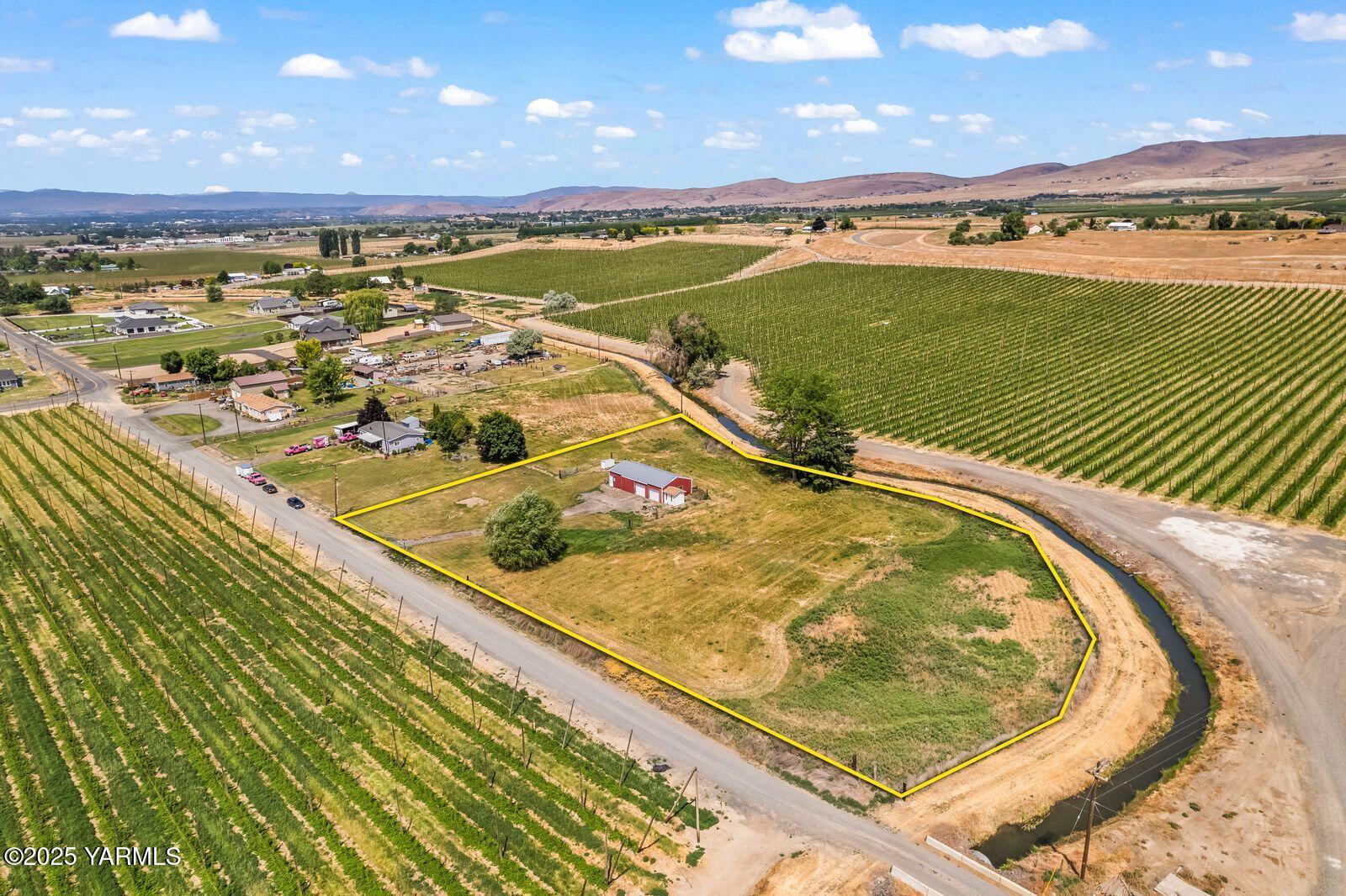 9031 Duffield Road Moxee, WA 98936 - Photo 9 of 19 a view of a swimming pool and an outdoor seating