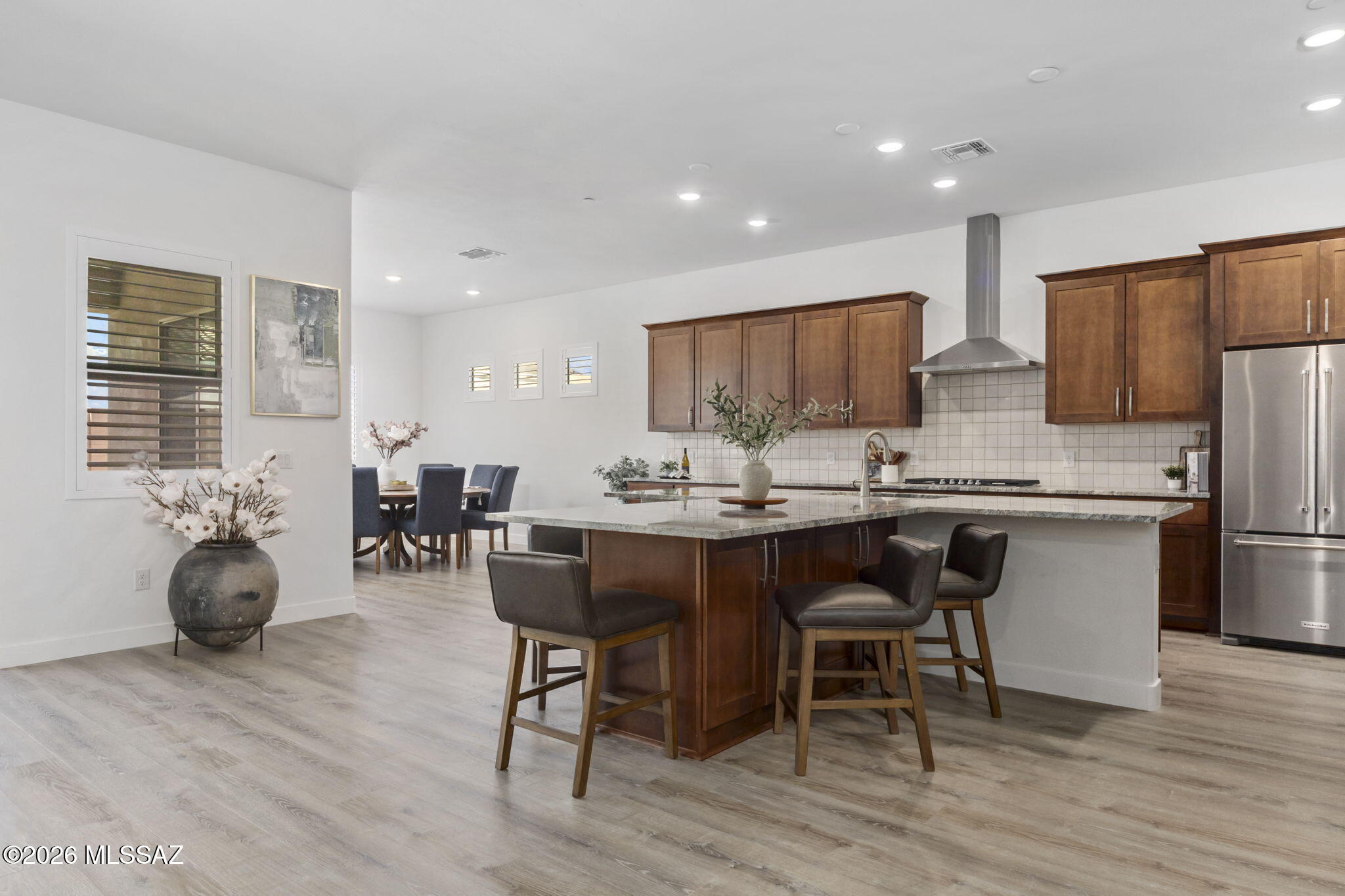 12791 East Tortoise Pointe Drive Vail, AZ 85641 - Photo 1 of 50 a dining room with stainless steel appliances a table and chairs