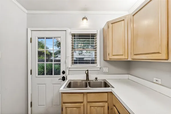 a kitchen that has a sink and a window