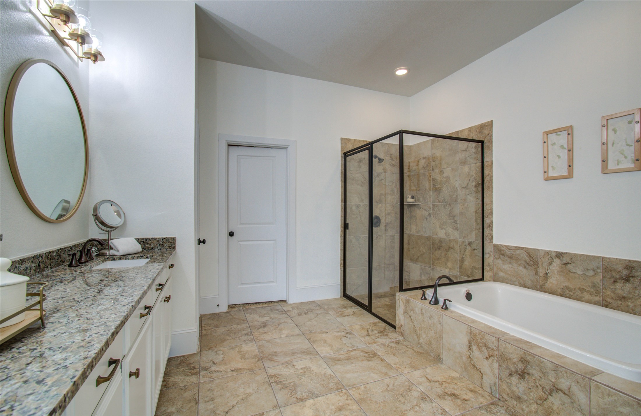 28627 Rolling Ridge Drive Katy, TX 77494 - Photo 25 of 44 a spacious bathroom with a granite countertop tub sink and mirror